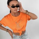 T-shirt bawełniany z nadrukiem Brand pomarańczowy