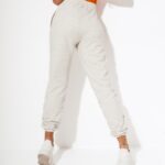 Spodnie ze ściągaczem Naomi O'la Voga beżowy melanż