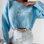 Sweter z poszarpaniem Karo Ola Voga błękitny