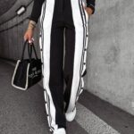 PRZEDSPRZEDAŻ Spodnie z lampasami CLYDE OLAVOGA czarne