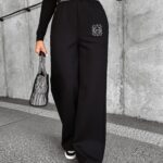 Spodnie o luźnym fasonie HOLLY OLAVOGA czarne