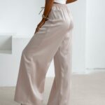 Spodnie z wyższym stanem dzwony NAVEEN OLAVOGA beżowe