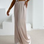 Spodnie z wyższym stanem dzwony NAVEEN OLAVOGA beżowe